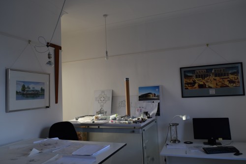 Architects studio in Macclesfield. Image shows drawing board, counter on structural glass supports, computer.