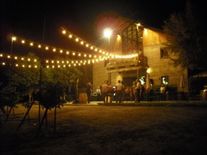 Nighttime image of winery building. Specialty's Cafe.